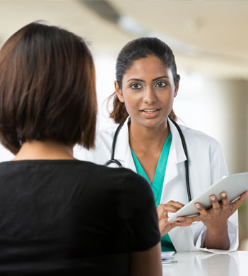 Young Female Doctor Consulting with Patient
