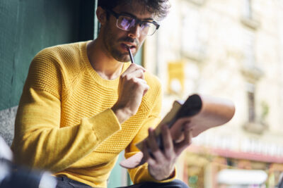 guy looking at notebook 