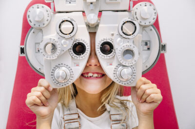 little girl getting eye exam 