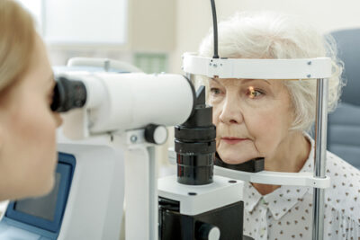 older woman receiving eye exams before cataract surgery