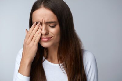 Woman suffering from dry eye treatment