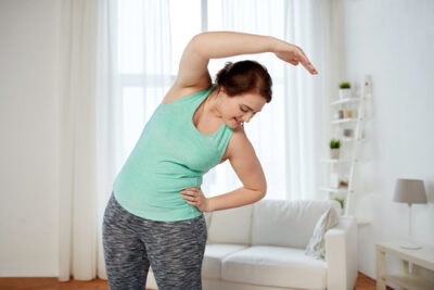 woman doing yoga in her home