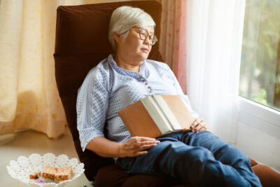 Woman sleeping with a book on her lap