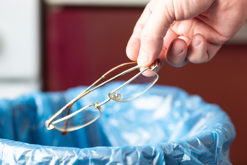 Putting glasses in the trash