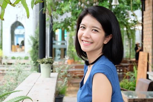 Woman outside smiling