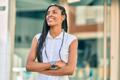 lady smiling with her arms crossed